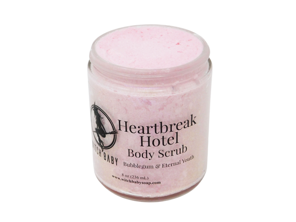 pink body scrub with clear front label that reads heartbreak hotel body scrub. bubblegum & eternal youth. 