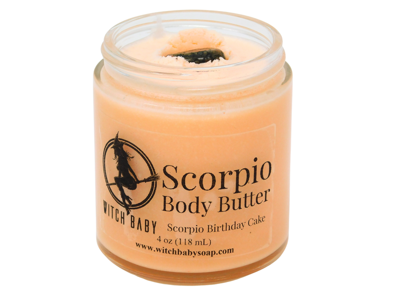 4 oz glass jar filled with orange body butter and topped with unakite. clear label reads: Scorpio Body Butter. Scorpio Birthday Cake. 