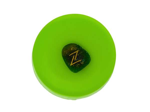 circular soap green in color with rune stone on top 